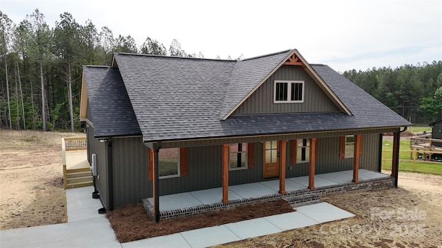 108 Big Hill Rd, Lawndale, NC 28090 - back of property featuring a shingled roof, covered porch, and a view of trees