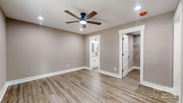 108 Big Hill Rd, Lawndale, NC 28090 - unfurnished bedroom featuring light wood-style floors, baseboards, recessed lighting, a spacious closet, and ensuite bath