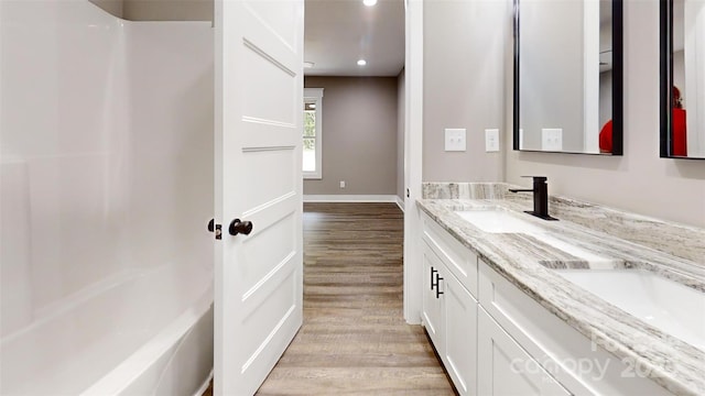 108 Big Hill Rd, Lawndale, NC 28090 - full bathroom featuring wood finished floors, double vanity, baseboards, recessed lighting, and bathtub / shower combination
