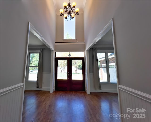484 Chisholm Trl, Rutherfordton, NC 28139 - foyer featuring a notable chandelier, wainscoting, french doors, and a healthy amount of sunlight