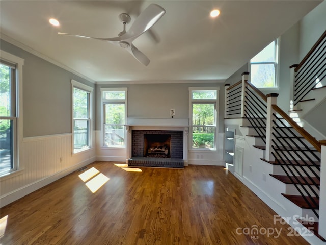 484 Chisholm Trl, Rutherfordton, NC 28139 - unfurnished living room with stairway, wood finished floors, a wainscoted wall, and crown molding