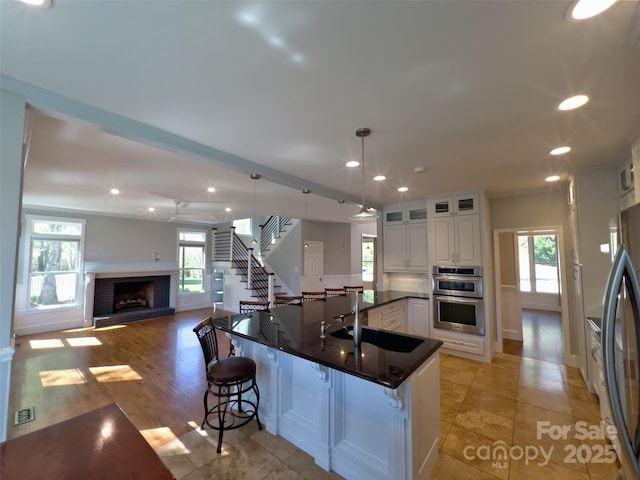 484 Chisholm Trl, Rutherfordton, NC 28139 - kitchen featuring dark countertops, a sink, stainless steel appliances, and a healthy amount of sunlight
