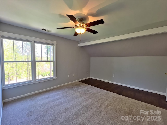 484 Chisholm Trl, Rutherfordton, NC 28139 - bonus room featuring visible vents, ceiling fan, dark colored carpet, and baseboards