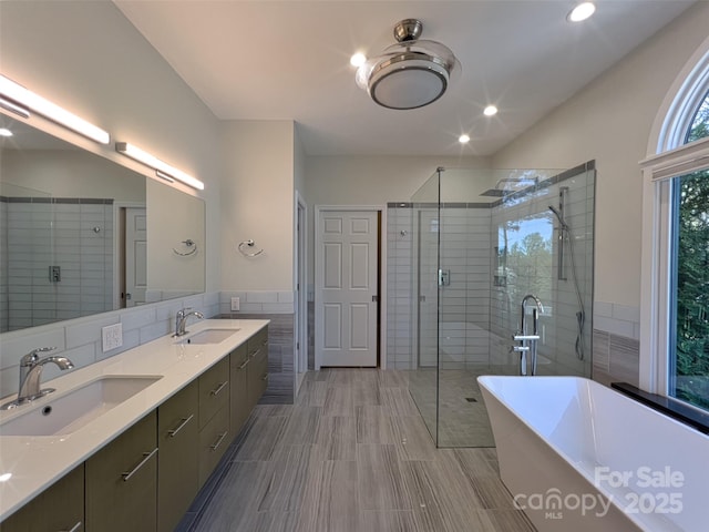 484 Chisholm Trl, Rutherfordton, NC 28139 - full bath featuring a stall shower, tile walls, and a sink