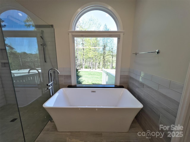 484 Chisholm Trl, Rutherfordton, NC 28139 - bathroom with tile walls, a tile shower, and a soaking tub