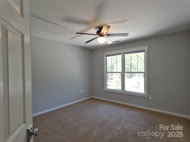 484 Chisholm Trl, Rutherfordton, NC 28139 - empty room featuring visible vents, carpet floors, baseboards, attic access, and a ceiling fan