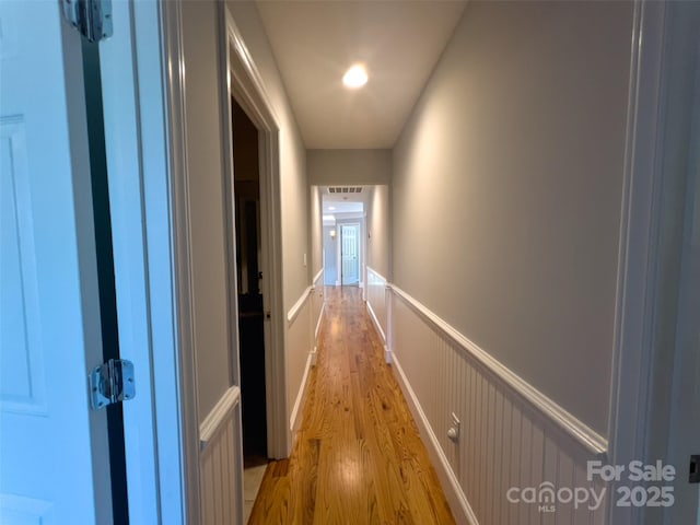 484 Chisholm Trl, Rutherfordton, NC 28139 - corridor with a wainscoted wall and light wood-type flooring