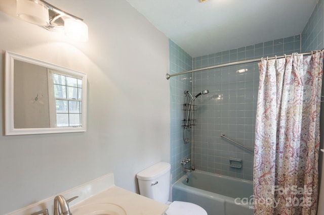 bathroom with shower / bath combo with shower curtain, toilet, and vanity