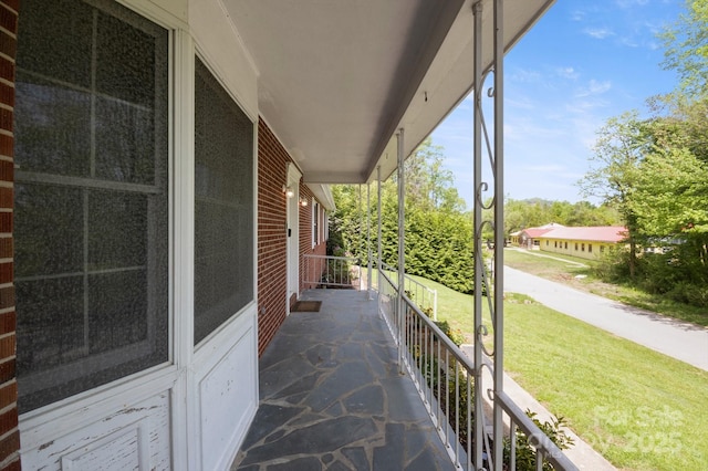 view of patio featuring a porch
