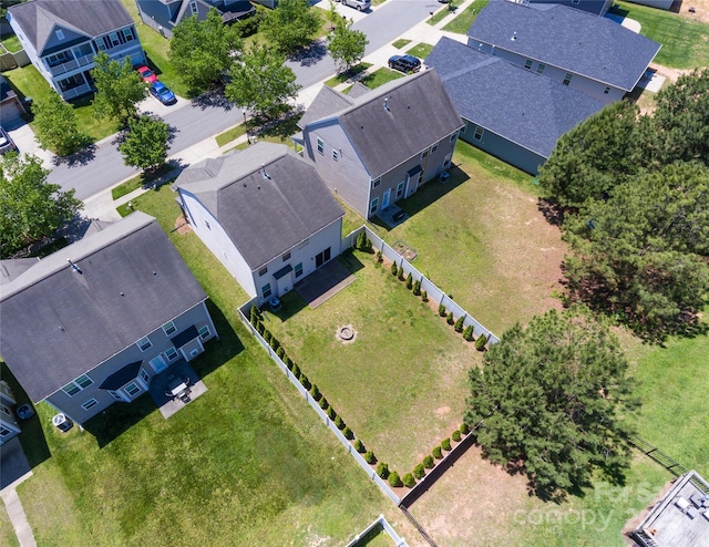 birds eye view of property with a residential view