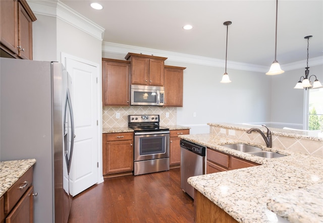 kitchen with dark wood-style floors, a sink, stainless steel appliances, decorative backsplash, and ornamental molding