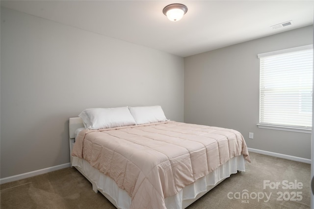 bedroom with carpet flooring, baseboards, and visible vents