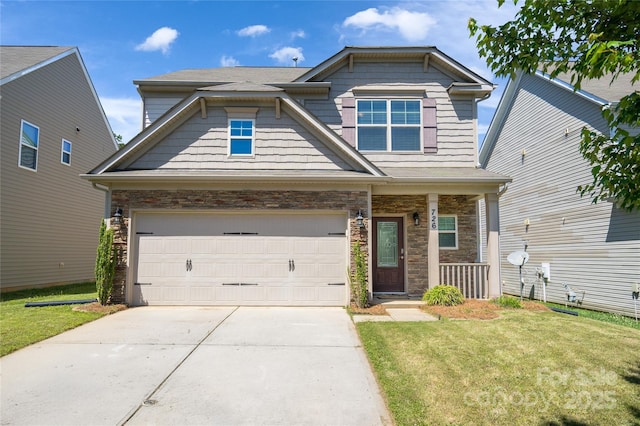craftsman inspired home with a garage, a front lawn, stone siding, and concrete driveway
