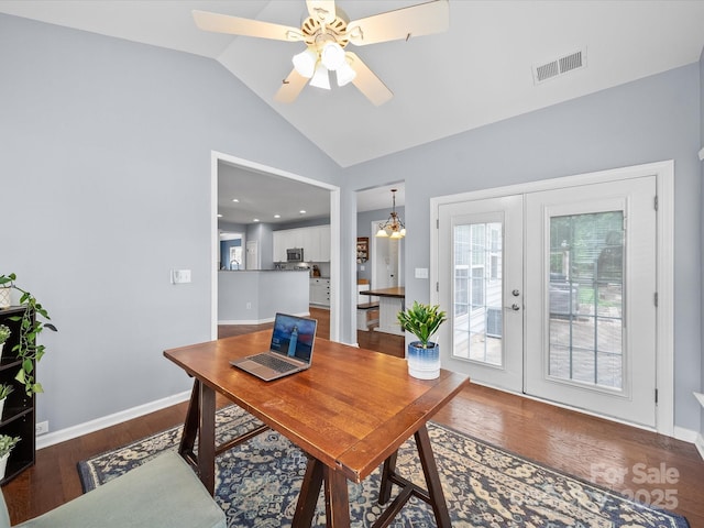 office featuring wood finished floors, vaulted ceiling, visible vents, a ceiling fan, and french doors