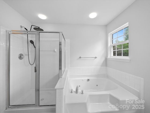 full bath featuring a whirlpool tub and a stall shower