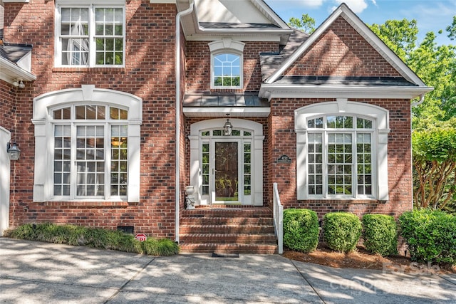 exterior space featuring brick siding