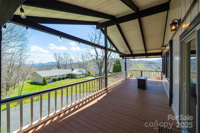 wooden terrace featuring a mountain view