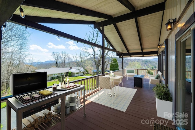 wooden deck with a mountain view