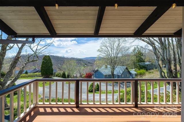wooden terrace with a residential view and a mountain view