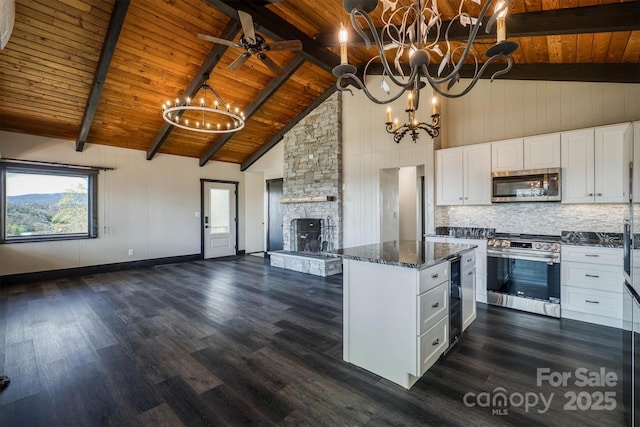 kitchen featuring wooden ceiling, high vaulted ceiling, open floor plan, wine cooler, and stainless steel appliances