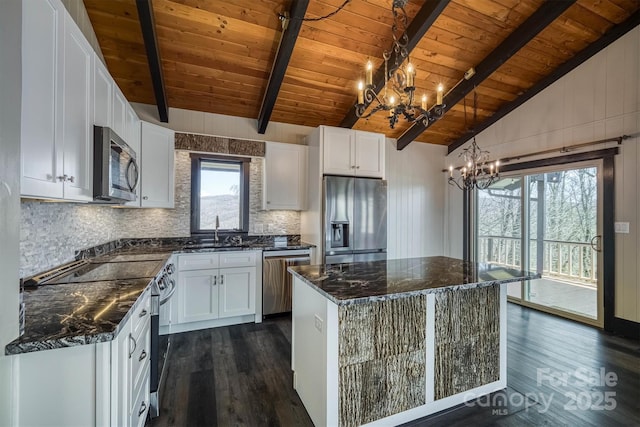 kitchen featuring wooden ceiling, appliances with stainless steel finishes, dark wood-style floors, and a notable chandelier