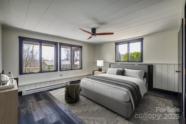 bedroom with ceiling fan and wood finished floors