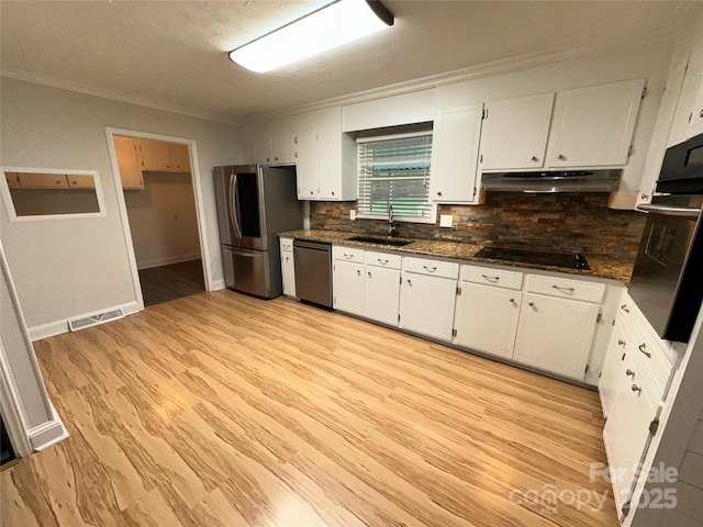 396 Pitts School Rd NW, Concord, NC 28027 - kitchen featuring stainless steel appliances, under cabinet range hood, ornamental molding, white cabinets, and backsplash