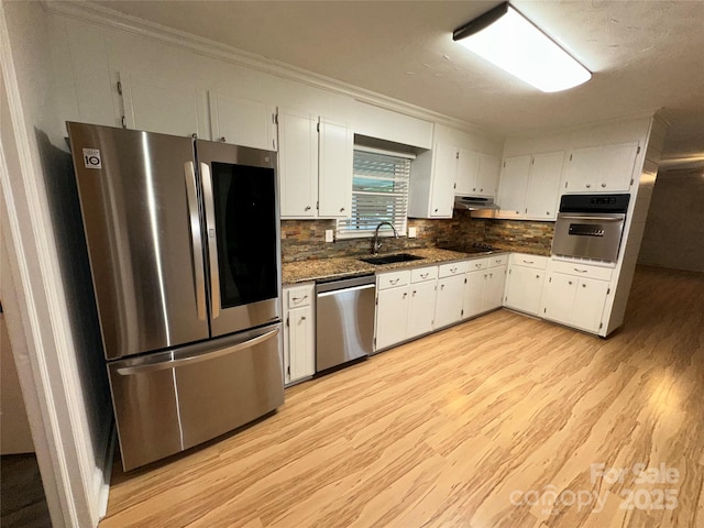 396 Pitts School Rd NW, Concord, NC 28027 - kitchen featuring stainless steel appliances, light wood-style flooring, white cabinets, under cabinet range hood, and crown molding