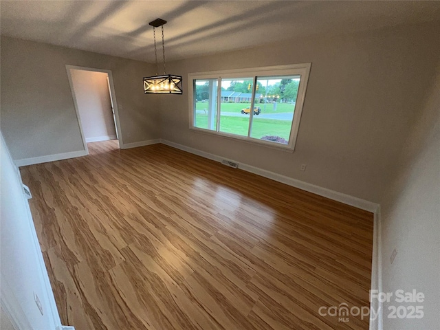 396 Pitts School Rd NW, Concord, NC 28027 - empty room featuring light wood-style flooring and baseboards
