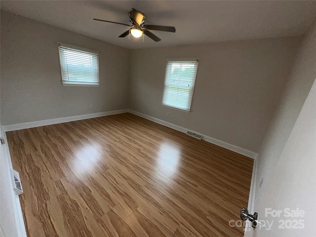 396 Pitts School Rd NW, Concord, NC 28027 - unfurnished room featuring wood finished floors and a ceiling fan