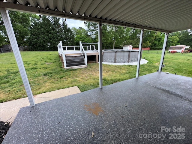 396 Pitts School Rd NW, Concord, NC 28027 - view of patio featuring a water view, an outdoor pool, and view of wooded area
