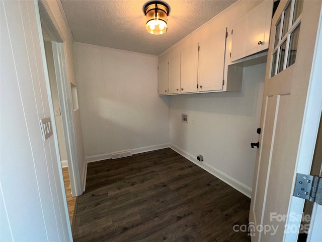 396 Pitts School Rd NW, Concord, NC 28027 - washroom with a textured ceiling, dark wood-type flooring, hookup for a washing machine, and cabinet space