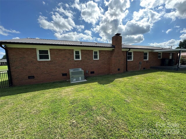 396 Pitts School Rd NW, Concord, NC 28027 - back of property featuring crawl space, a chimney, a metal roof, and brick siding