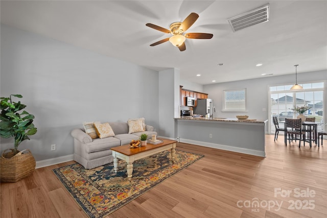 233 E Waterlynn Rd Unit B, Mooresville, NC 28117 - living area with a ceiling fan, light wood-style floors, and recessed lighting