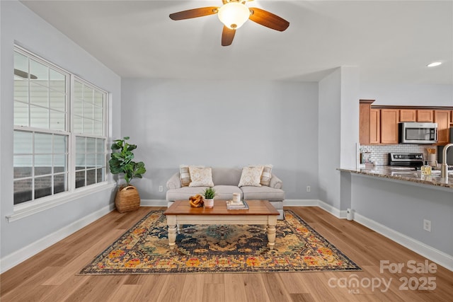 233 E Waterlynn Rd Unit B, Mooresville, NC 28117 - living room with light wood finished floors, ceiling fan, and recessed lighting