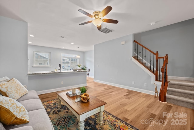 233 E Waterlynn Rd Unit B, Mooresville, NC 28117 - living room with ceiling fan, stairs, light wood-style floors, and recessed lighting