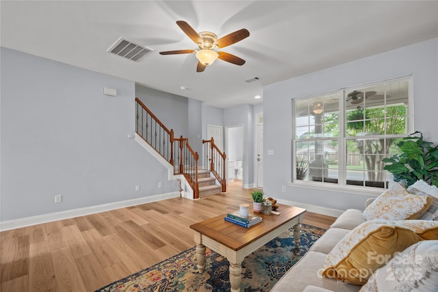 233 E Waterlynn Rd Unit B, Mooresville, NC 28117 - living area featuring a ceiling fan, stairway, and light wood-type flooring