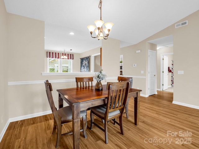 5802 Wood Duck Way, Hendersonville, NC 28792 - dining area featuring a chandelier, light wood-style flooring, baseboards, and recessed lighting