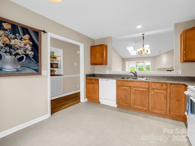 5802 Wood Duck Way, Hendersonville, NC 28792 - kitchen featuring white dishwasher, a sink, a chandelier, brown cabinetry, and recessed lighting