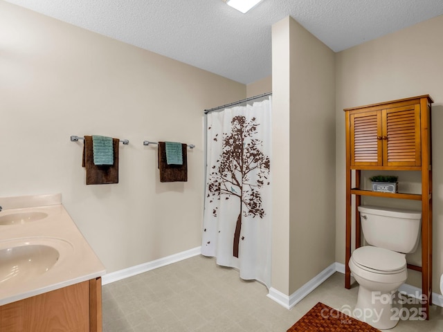 5802 Wood Duck Way, Hendersonville, NC 28792 - bathroom featuring toilet, double vanity, baseboards, a shower with curtain, and a textured ceiling