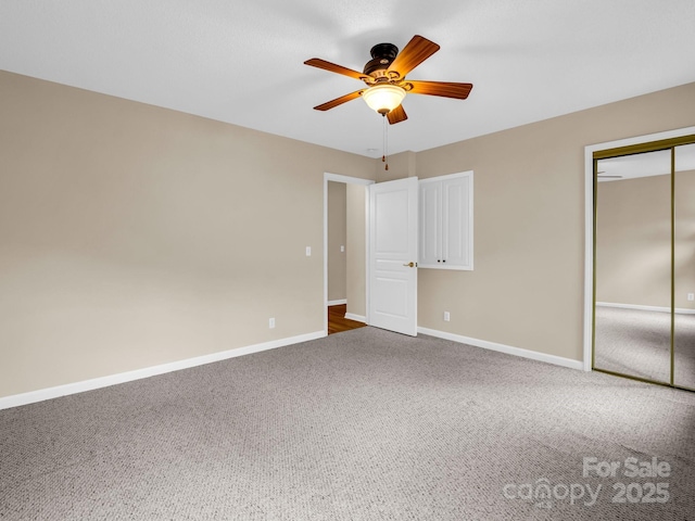 5802 Wood Duck Way, Hendersonville, NC 28792 - unfurnished bedroom with baseboards, carpet floors, a closet, and a ceiling fan