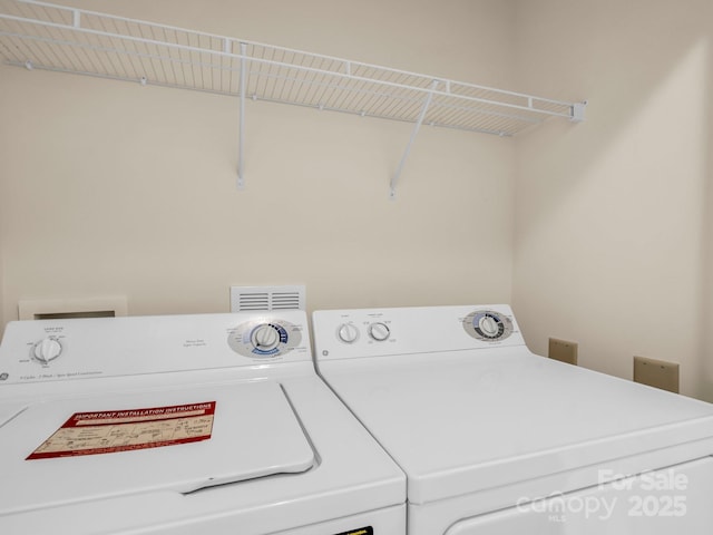 5802 Wood Duck Way, Hendersonville, NC 28792 - laundry area with washer and clothes dryer