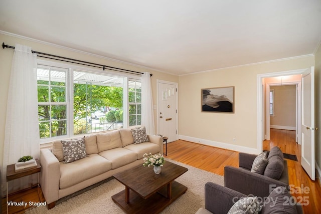 2125 Chatham Ave, Charlotte, NC 28205 - living area featuring crown molding, baseboards, and wood finished floors