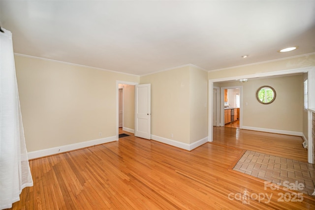 2125 Chatham Ave, Charlotte, NC 28205 - empty room featuring baseboards, ornamental molding, and light wood-style floors