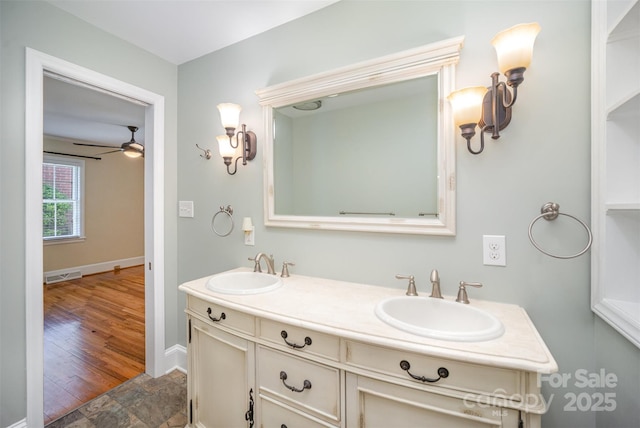 2125 Chatham Ave, Charlotte, NC 28205 - bathroom featuring a sink, baseboards, double vanity, and visible vents