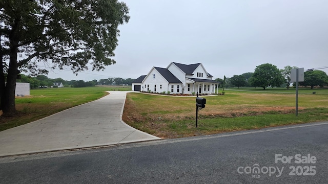 1706 Ruben Rd, Monroe, NC 28112 - view of front of home with driveway and a front yard