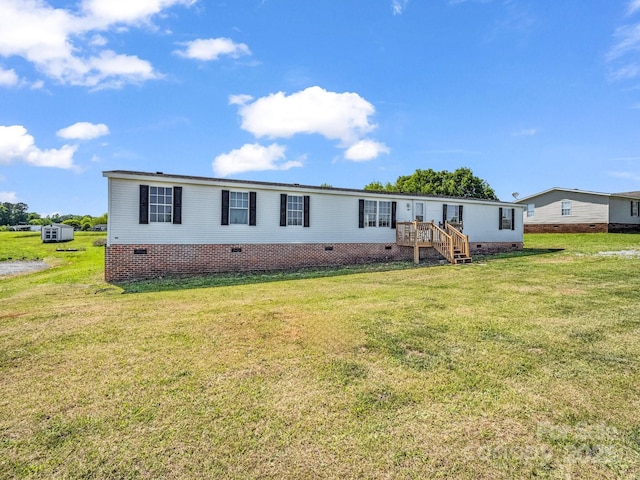 manufactured / mobile home with crawl space and a front yard