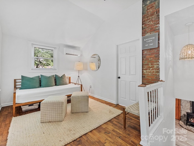 24 Iroquois St, Black Mountain, NC 28711 - living room featuring a wall mounted AC, vaulted ceiling, hardwood / wood-style flooring, baseboards, and a wood stove