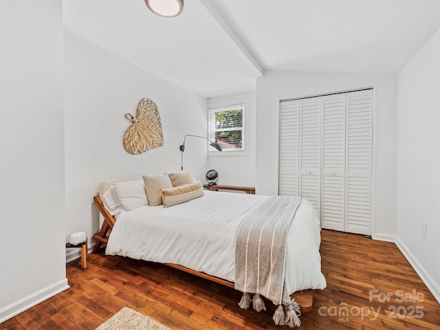 24 Iroquois St, Black Mountain, NC 28711 - bedroom featuring wood finished floors, baseboards, vaulted ceiling, and a closet