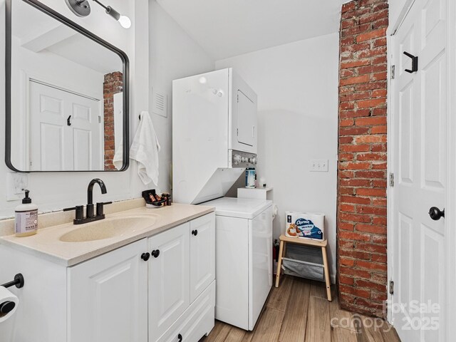24 Iroquois St, Black Mountain, NC 28711 - laundry area featuring stacked washer / dryer and light wood-type flooring